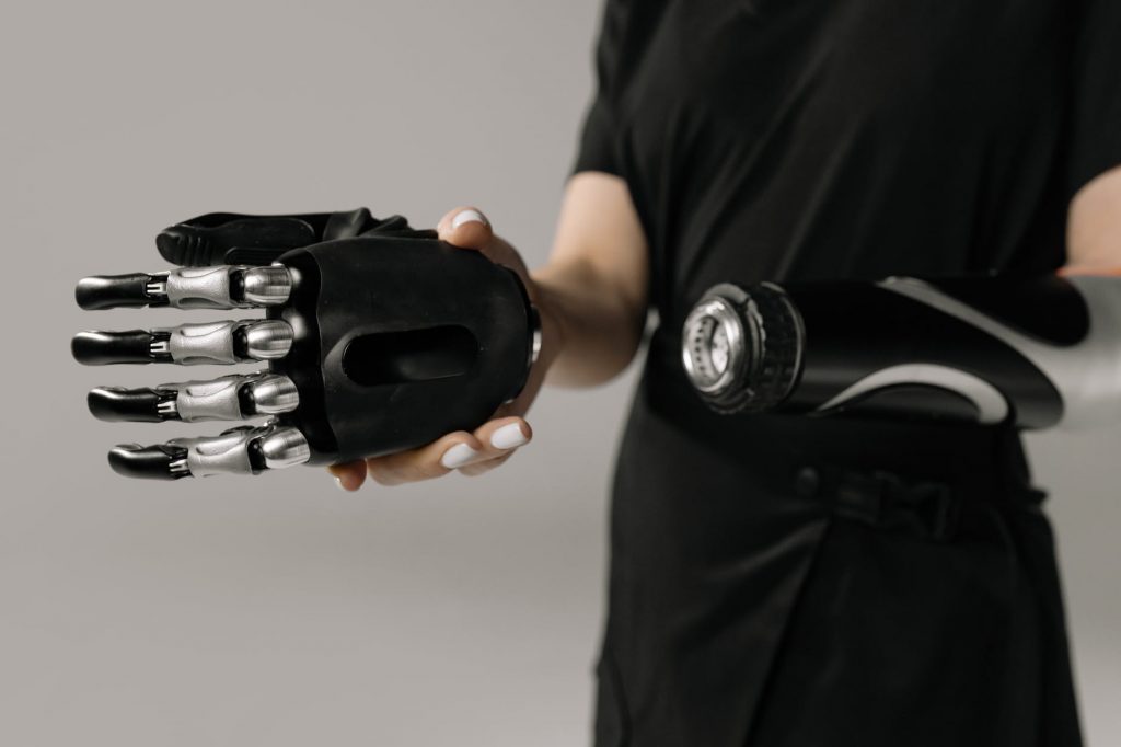 person holding black and silver hand tool