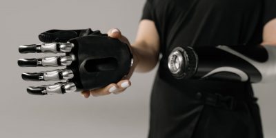 person holding black and silver hand tool